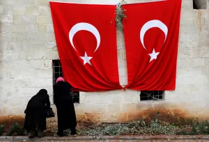 Women inspect a mosque which was hit by a rocket fired from Syria Women inspect a mosque which was hit by a rocket fired from Syria