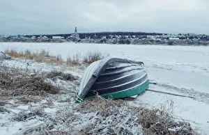 Prints of A wooden boat is seen on a bank of frozen Varzuga river in the village of Varzuga in Murmansk region, Russia October 31, 2019. REUTERS/Maxim Shemetov Russia Prints: A wooden boat is seen on a bank of frozen Varzuga river in the village of Varzuga in